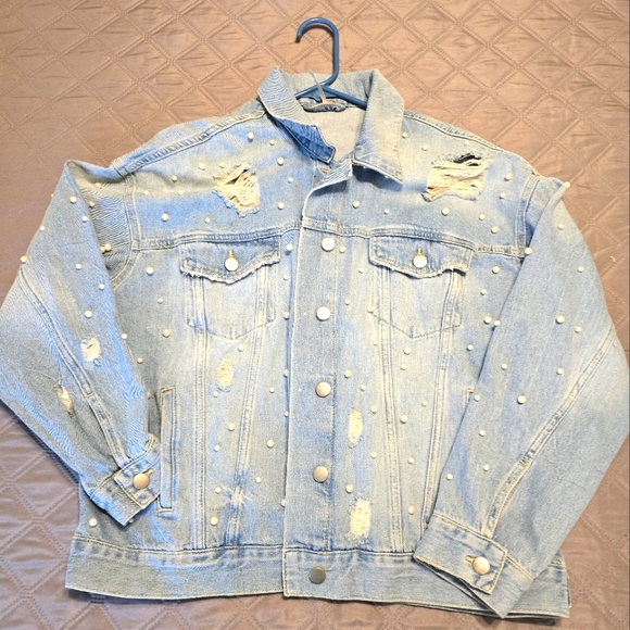 Free People classic cut denim jacket adorned with pearl accents. - Picture 1 of 9